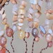 symphony of earthy sunstone strung on brown wire branches